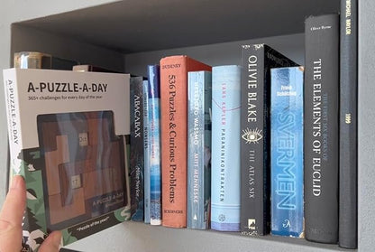 A-Puzzle-A-Day Premium Boxed Edition: The Original Calendar Puzzle with 365+ Challenges for Every Day of The Year, by DragonFjord, with Magnetic Storage Box and Hint Book.