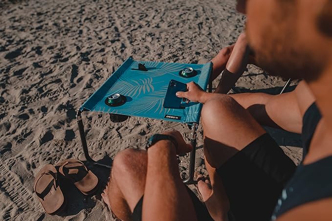Neso Portable Beach Table with Cup Holders, Cell Phone Pockets, Lightweight for Picnics and Parks (Aqua Fronds)