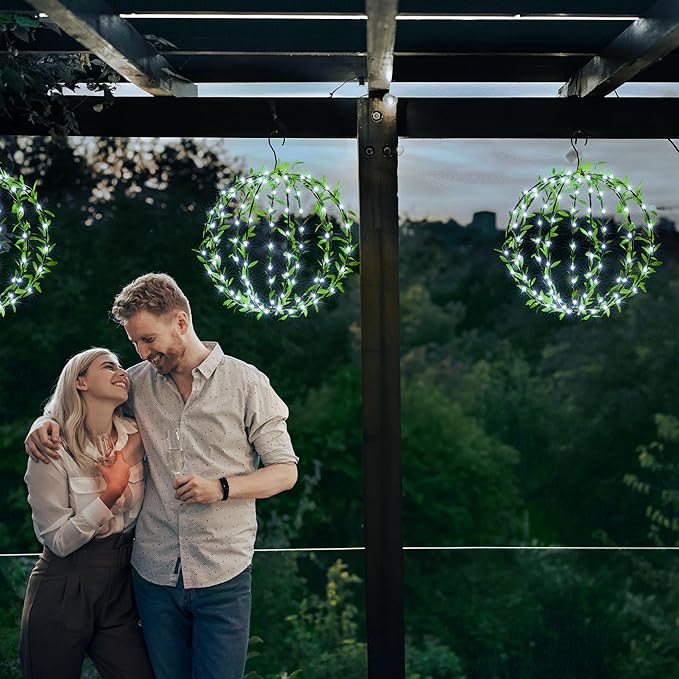 Solar Powered Hanging Iron Sphere Lights with Artificial Greenery – 12Inch 120 LED Waterproof Outdoor Decor Ball Light with Timer & 8 Modes – 2 Pack for Garden, Christmas, Weddings (Cool White)